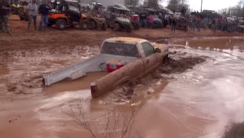 Dirty Silverado floats through the mud  